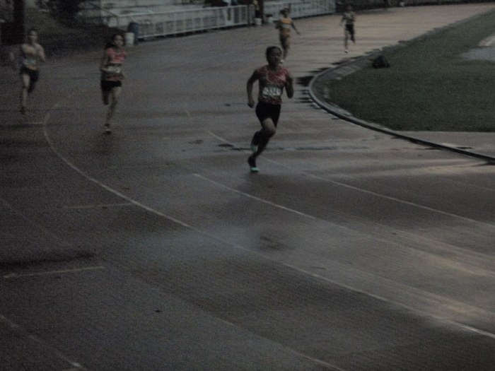 Jenny Rosales rounds the first curve well ahead of team mate Neslee Angco.